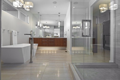 Bathroom - large contemporary master beige tile and porcelain tile porcelain tile bathroom idea in Edmonton with flat-panel cabinets, medium tone wood cabinets, a one-piece toilet, white walls, an undermount sink and quartz countertops
