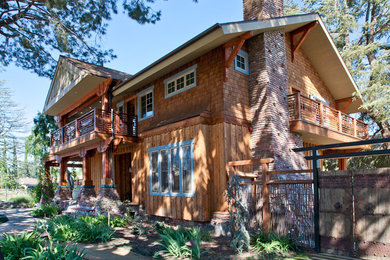 Example of a large mountain style brown two-story wood exterior home design in Los Angeles with a shingle roof