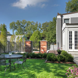 Traditional garden in St Louis with natural stone pavers and with lawn edging.