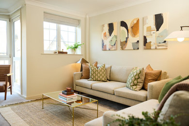 Medium sized midcentury enclosed living room in Other with beige walls, carpet and beige floors.