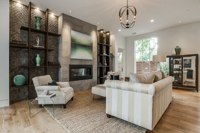 Inspiration for an expansive transitional open concept living room in Dallas with white walls, light hardwood floors, a standard fireplace and a stone fireplace surround.
