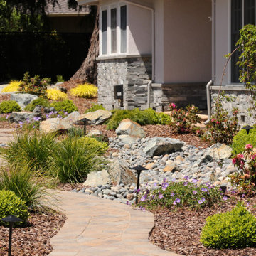 FRONT YARD WITH TREES AND DRY-CREEK