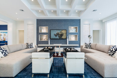 Example of a large trendy open concept and formal carpeted and blue floor living room design in Miami with white walls, no fireplace and no tv