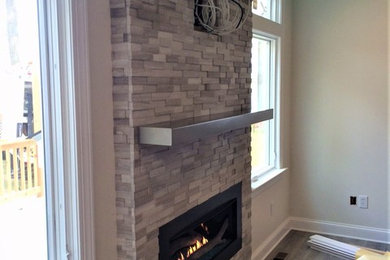 New Linear Gas fireplace & Stacked Stone on Blank Wall.....Magic Make Over