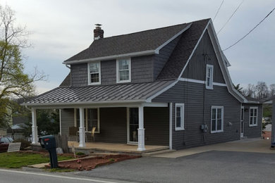 Exterior in Other with mixed siding and a shingle roof.