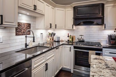 Inspiration for a timeless brown floor kitchen remodel in Cincinnati with an island