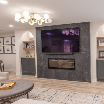 Warm & Inviting Basement Retreat with Custom Bar + Entertainment Center