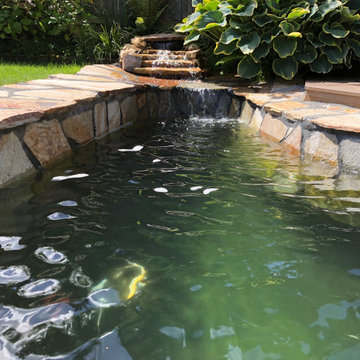 Koi pond installation with flagstone patio