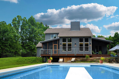Inspiration for a mid-sized timeless backyard concrete and rectangular pool remodel in Indianapolis