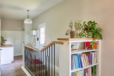 Example of a country vinyl floor and brown floor hallway design in Kansas City