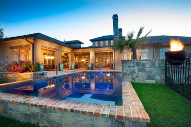 Hot tub - huge rustic courtyard brick and rectangular hot tub idea in New Orleans
