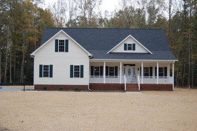 Large white two-story wood exterior home idea in Richmond