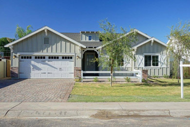 Farmhouse board and batten exterior home photo in Phoenix