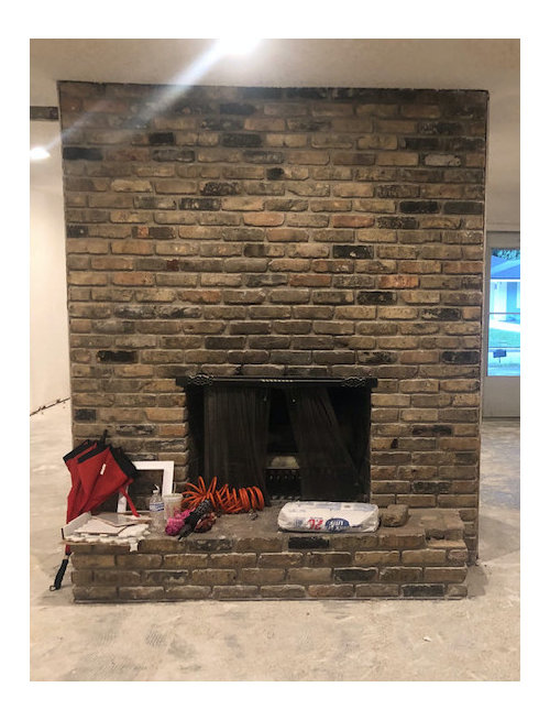 Trying to decide if we want to paint this fireplace or not.
