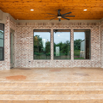 Traditional Brick Home with an Airplane Hanger