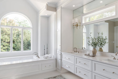 Large transitional master white tile and porcelain tile porcelain tile, yellow floor, double-sink and tray ceiling bathroom photo in St Louis with shaker cabinets, white cabinets, white walls, an undermount sink, quartzite countertops, white countertops and a built-in vanity