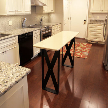 Medallion Painted White Chocolate Kitchen Cabinets with Petal Mosaic Backsplash