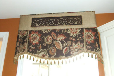 Window treatments with decorative tableaux hardware