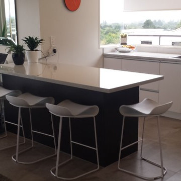 Gloss Laminate benchtops with White and Dark Wood cabinetry