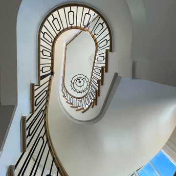 Project #95 | Freestanding Elliptical Staircase with Geometric Iron Balusters