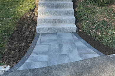 Photo of a side yard concrete paver landscaping in Boston.