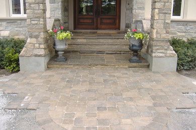 Inspiration for a large full sun stone landscaping in Toronto.