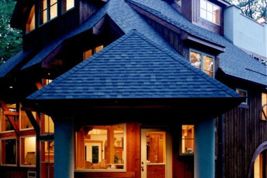 Example of a large trendy brown two-story wood house exterior design in Philadelphia with a shingle roof