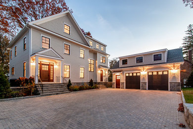 Large transitional beige three-story house exterior idea in New York