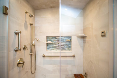 Example of a transitional gray tile and porcelain tile porcelain tile bathroom design in DC Metro with a hinged shower door