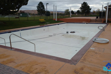 Inspiration for a large contemporary rectangular lap pool in Boise with concrete slab.