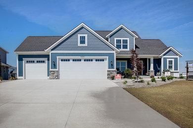 Example of a beach style exterior home design in Grand Rapids