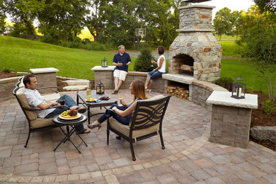 Inspiration for a small transitional backyard patio in Minneapolis with a fire feature, concrete pavers and no cover.