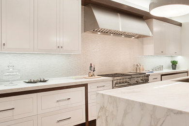 Eat-in kitchen - large modern single-wall medium tone wood floor eat-in kitchen idea in San Francisco with a single-bowl sink, flat-panel cabinets, white cabinets, marble countertops, white backsplash, matchstick tile backsplash, stainless steel appliances and an island