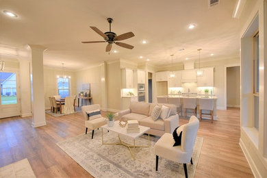 Living room - transitional formal and open concept medium tone wood floor and brown floor living room idea in New Orleans with beige walls, a standard fireplace, a brick fireplace and no tv
