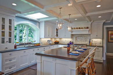 Design ideas for a traditional kitchen in New York with an undermount sink, recessed-panel cabinets, distressed cabinets, soapstone benchtops, stone tile splashback and dark hardwood floors.