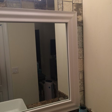 Bathroom redo with framed mirror and antique mirror tiles