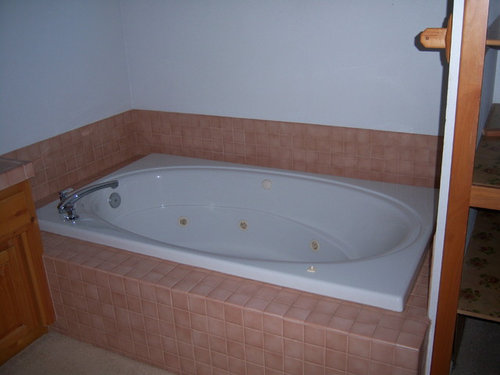 Can whirlpool tub be converted to regular tub?