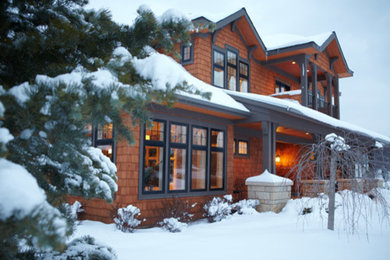 Mid-sized traditional two-storey brown exterior in Minneapolis with wood siding.