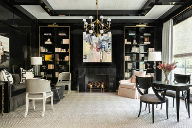 Example of an eclectic living room library design in Houston with black walls and a stone fireplace