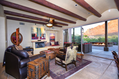 Mid-sized southwest formal and enclosed terra-cotta tile living room photo in Phoenix with beige walls, a standard fireplace, a plaster fireplace and no tv
