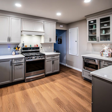 Two-Tone Neutral Kitchen with Quartz Countertop and Soho Picket Backsplash