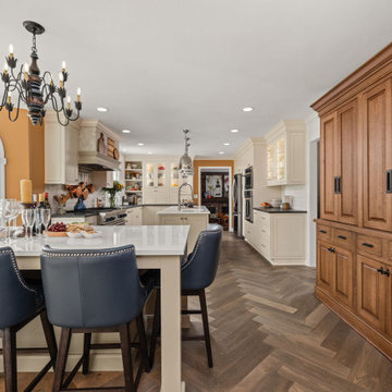 Warm Traditional Kitchen Remodel with Cream Cabinets & Herringbone Floors