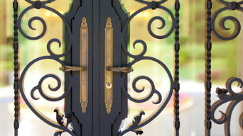 Custom ornate wrought iron / glass front entry door 24k gold plated handles.