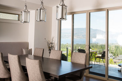 Dining room - contemporary dark wood floor dining room idea in Vancouver with white walls