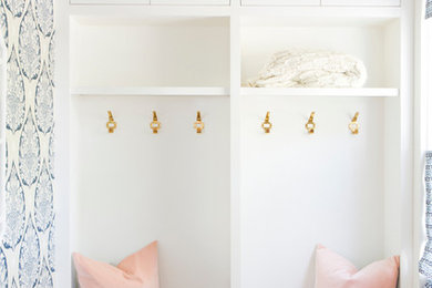 Small transitional light wood floor entryway photo in San Francisco with blue walls