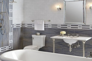 Bathroom - large contemporary master gray tile, white tile and subway tile bathroom idea in New York with a two-piece toilet, multicolored walls, a console sink and marble countertops