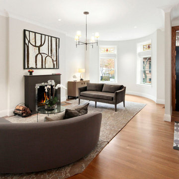 Open Living Room with Fireplace and Curved Sofa