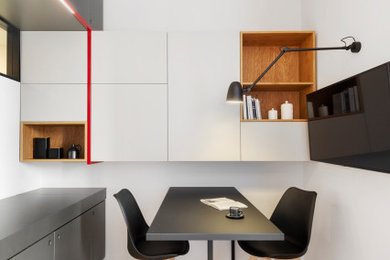Example of a trendy dining room design in Milan