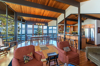 Living room - rustic open concept medium tone wood floor living room idea in Other with white walls