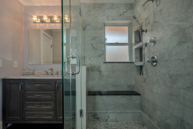 Inspiration for a mid-sized contemporary master multicolored tile and marble tile bamboo floor and brown floor corner shower remodel in Miami with shaker cabinets, gray cabinets, gray walls, an undermount sink, marble countertops, a hinged shower door and multicolored countertops